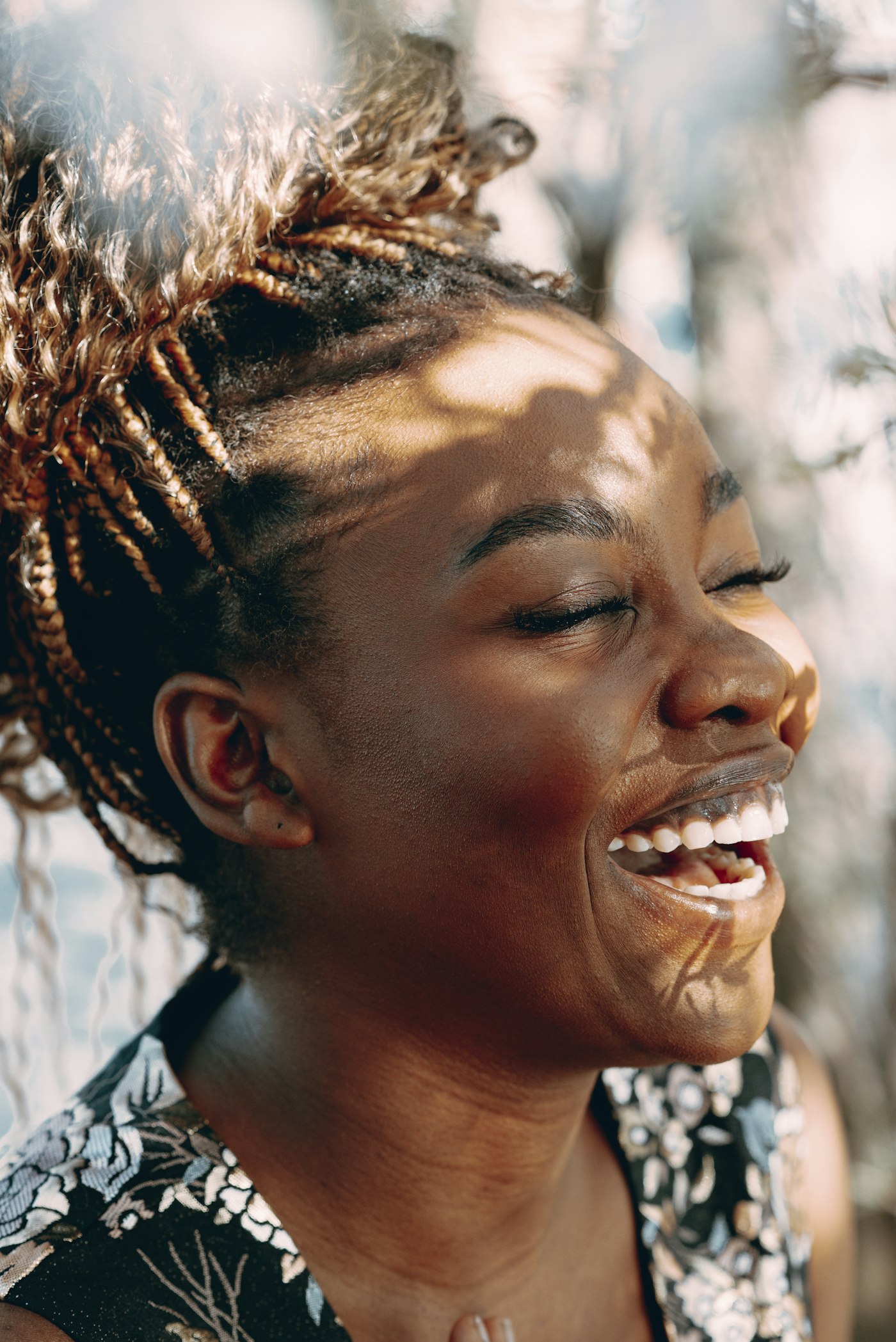 Woman laughing in warm sunlight